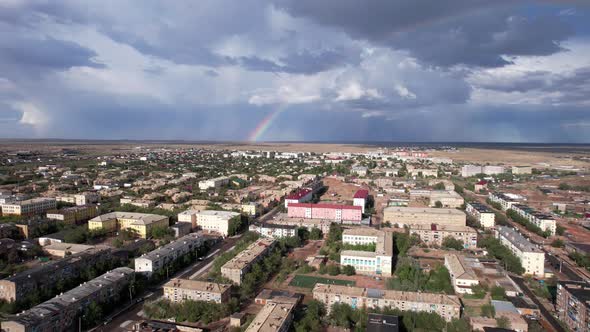 Bright Rainbow and Rain Over the City of Balkhash