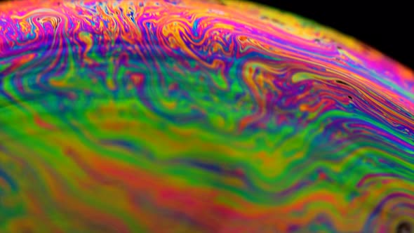 Soap bubble macro rainbow colors creating