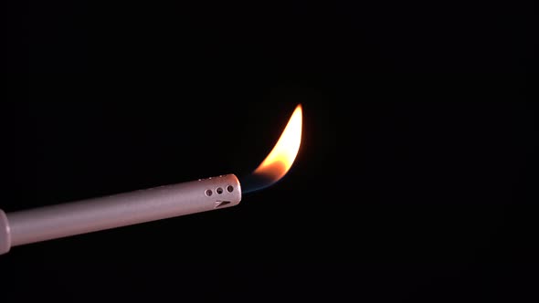 Burning Gas Lighter Isolated on Black Background