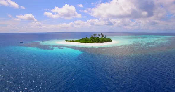 Aerial drone view of a scenic tropical island in the Maldives.