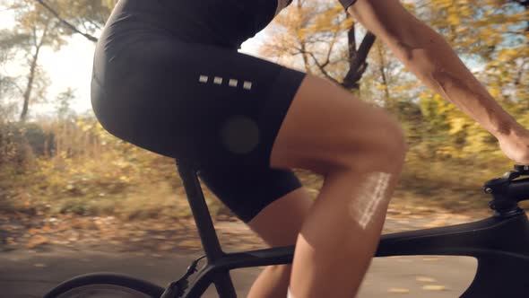 Cyclist Training Leisure Twists Pedals On Triathlon Bicycle. Gear System  And Bike Wheel. Workout.