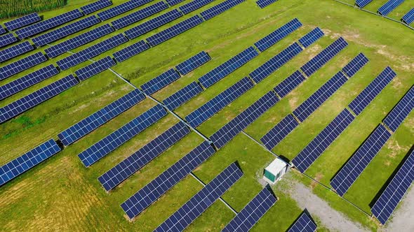 Drone flight over solar panels field. Aerial drone point view of powerful station with solar panels 