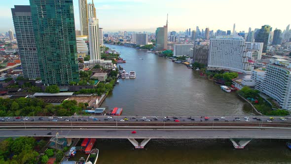 4K : Drones fly over the Chao Phraya River, buildings and business districts in Bangkok