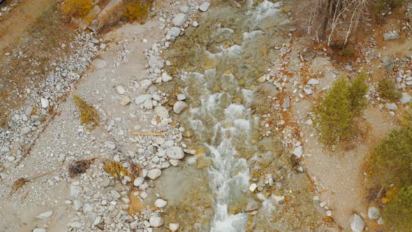 Wild mountain river Splashing Water  View from the drone on the river Eastern Sayan Arshan