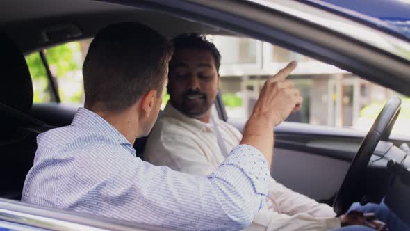 Car Driving School Instructor Teaching Male Driver