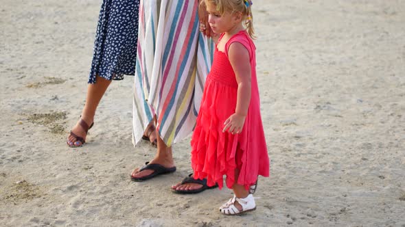 Moms with Children Spend Time on the Beach
