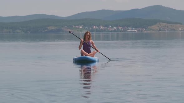 Sporty Woman Paddling in Water