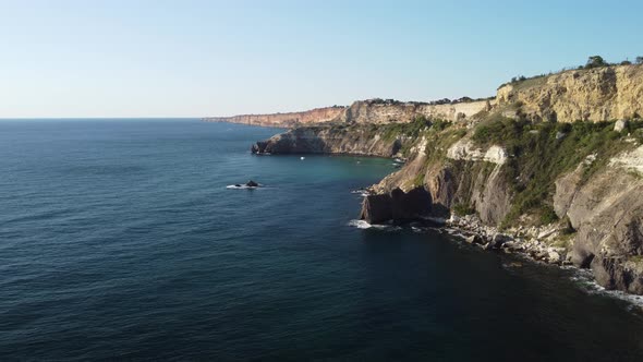 Aerial Panoramic View of Seascape with Crystal Clear Azure Sea and Rocky Shores