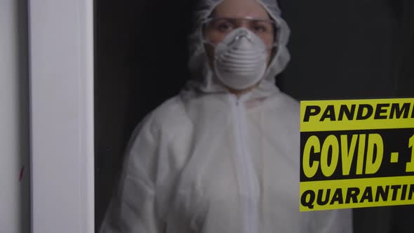 Woman in Protective Suit in Quarantine Zone. Coronovirus and Isolation Concept