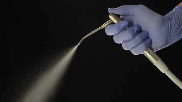 Dental Medical Equipment on Black Background Splashing Water in Slow Motion