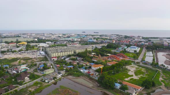 Aerial top view of Samut Prakan urban city, Thailand. Architecture buildings with sea.