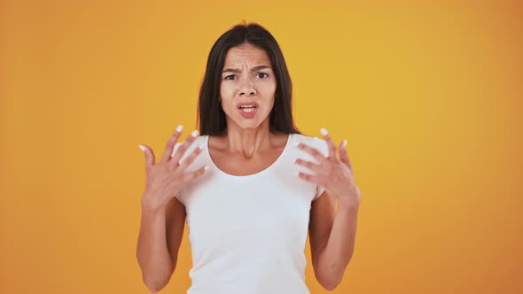 Woman Shrugging Shoulders Asking What Being Disappointed and Upset