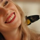 Laughing Woman with a Butterfly in her Hair - VideoHive Item for Sale