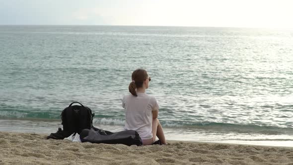 Girl Sitting By the Sea on the Sand in Alanya, Turkey