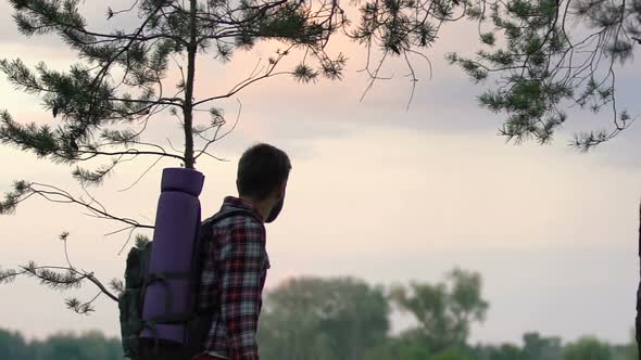 Inspired Male Backpacker Enjoying Amazing Sunset From Woodland Hill, Freedom