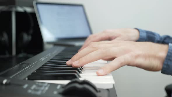 Hands playing piano