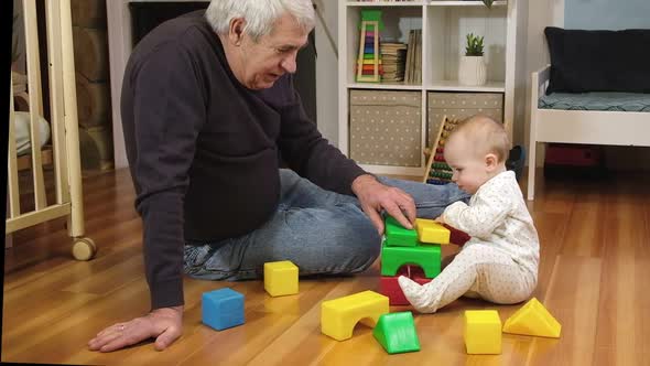 Grandfather Playing with Little Baby