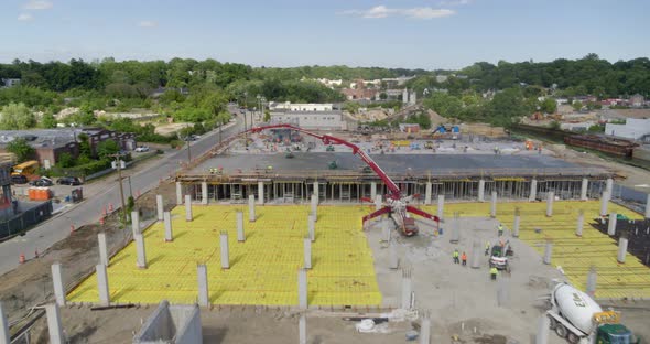 Flying Over a Construction Site in a Small Town