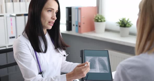 Woman Doctor Shows Patient Xray of Lungs on Tablet Slow Motion  Movie