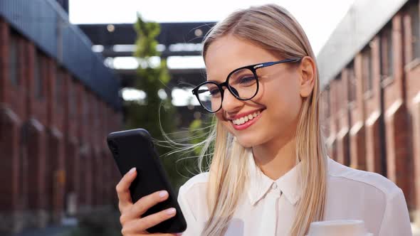 Attractive Happy Young Blond Woman Use Cellphone Smiling