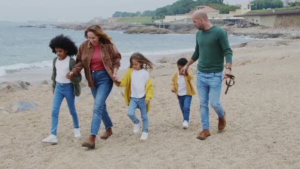 Big Family Is Walking On Beach