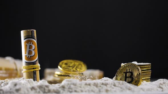 Golden Crypto Coins Fall Down on Powder and Rolls