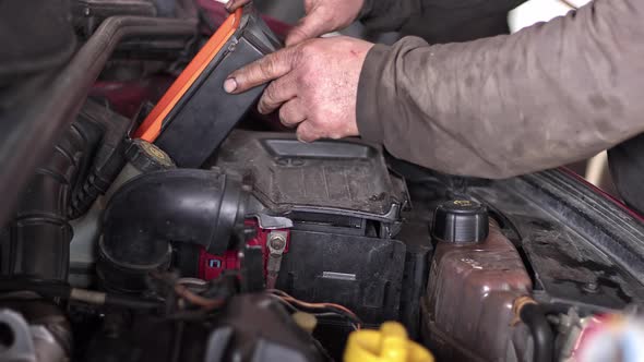 Installing The New Air Filter In The Car Engine