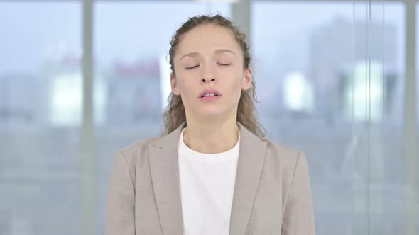 Portrait of Upset Young Businesswoman Crying at Camera