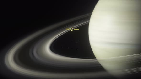 Saturn And A Spacecraft Orbiting The Planet And Its Ring System