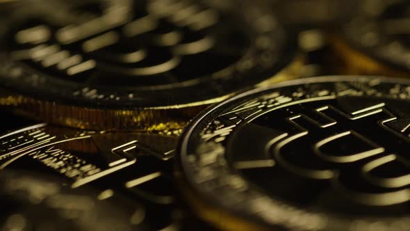 Rotating shot of Bitcoins (digital cryptocurrency) - BITCOIN 0565