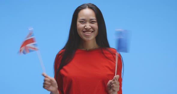 Young Woman Waving with EU and UK Flag