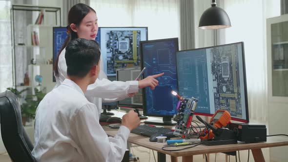 Asian Team Of Multi Engineers, Scientists Work On Tablet And Computer, Talk, Design Pcb