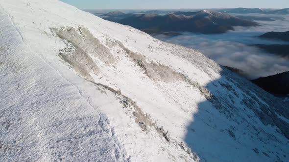 Aerial Unveil Shot of Winter Mountain Valley