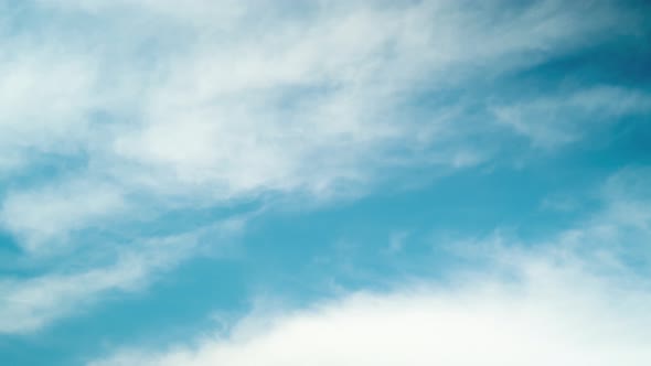 4k Time lapse of white clouds on blue sky.