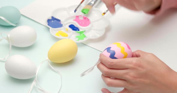 Painting on egg for Easter holiday