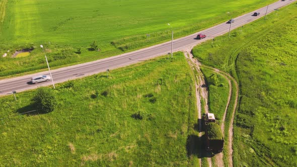 Nice Aerial View of the Tractor Carrying a Full Cart of Cut Grass