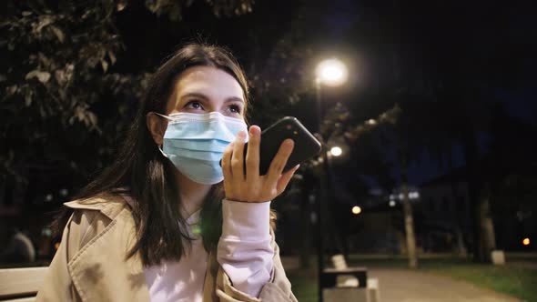 Young Woman Using Smartphone Voice Recognition Message on Speakerphone