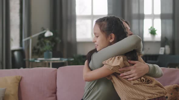 Loving Mom And Daughter Hugging