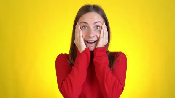 Beautiful Young Woman Posing Isolated on Yellow Background in Studio