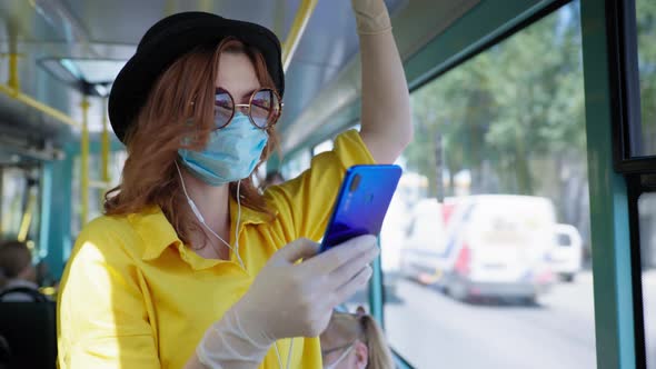 Young Female Passenger Wearing Hat with Glasses Observes Safety Precautions Wears Medical Mask and