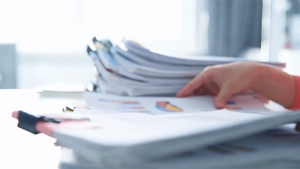 Accountant Woman Checking Report For Analysis Information.