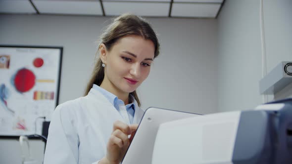 The Ophthalmologist Examines the Patient's Eye and Then Looks Into the Camera