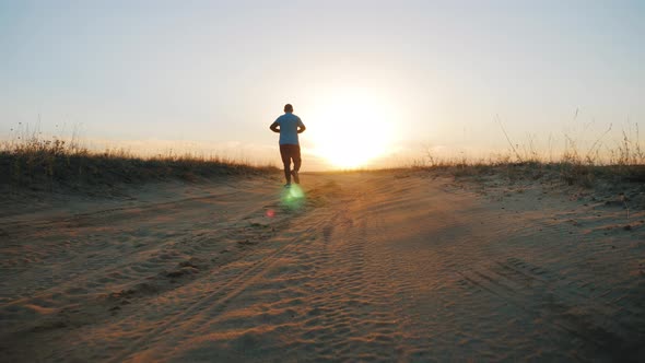 Running Man Silhouette in Sunset Time