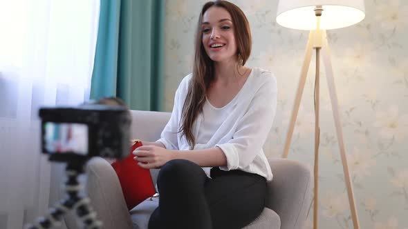 Fashion Blogger Filming Video On Camera At Home