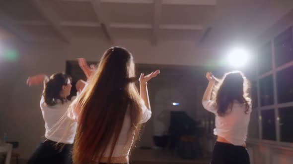 Girls in Black Skirts are Dancing in the Studio