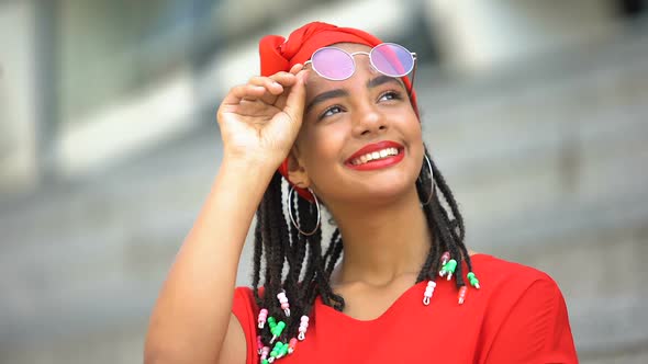 Dreamy Mixed-Race Girl Looking at Plane in Sky Imaging Traveling, Reflection