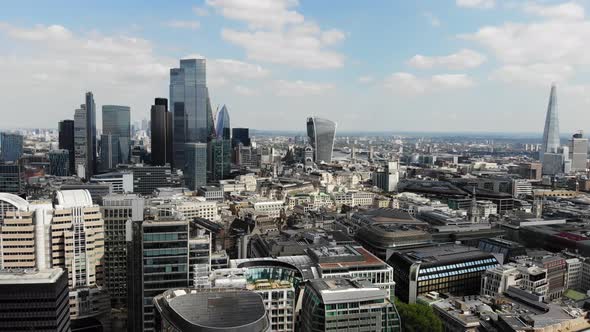 Rotating aerial view of London Financial and Banking district on a sunny day