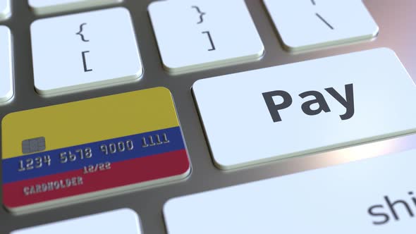 Bank Card with Flag of Colombia As a Key on a Keyboard alt