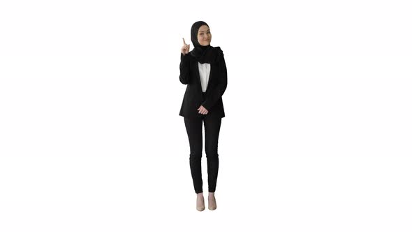 Arab Businesswoman in Hijab Raising Finger and Nodding Head in Approval on White Background