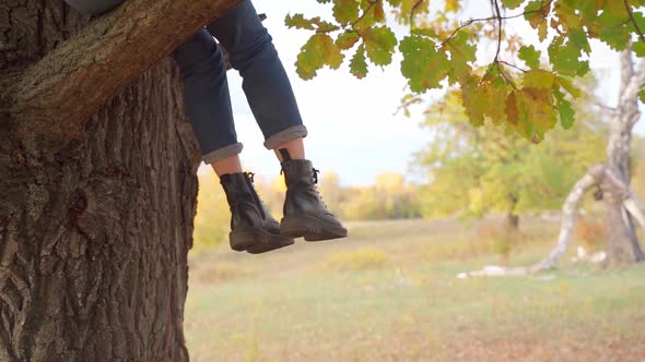 Girl Tourist on a Hike in the Autumn Forest